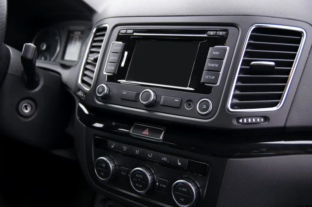 Aftermarket car stereo head unit mounted in a dashboard
