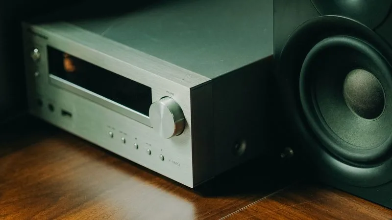 A multi-channel car amplifier mounted on a board with power and speaker wiring attached