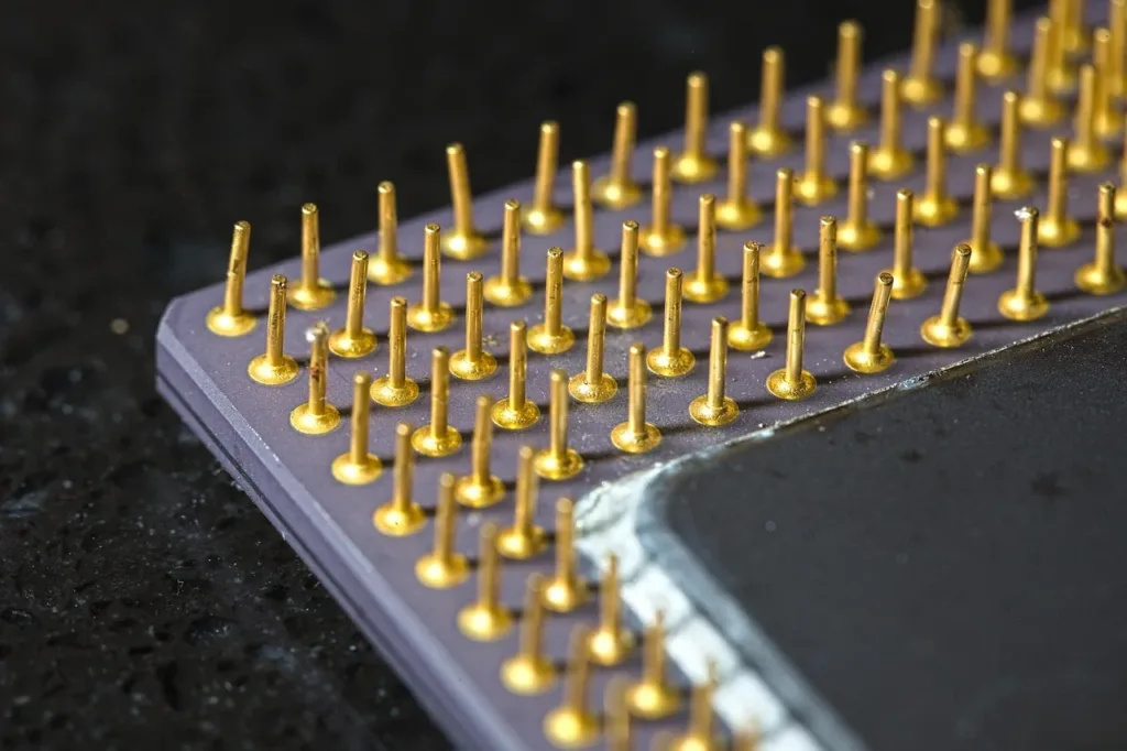 Close-up of a processor chip with gold pins used for digital audio processing