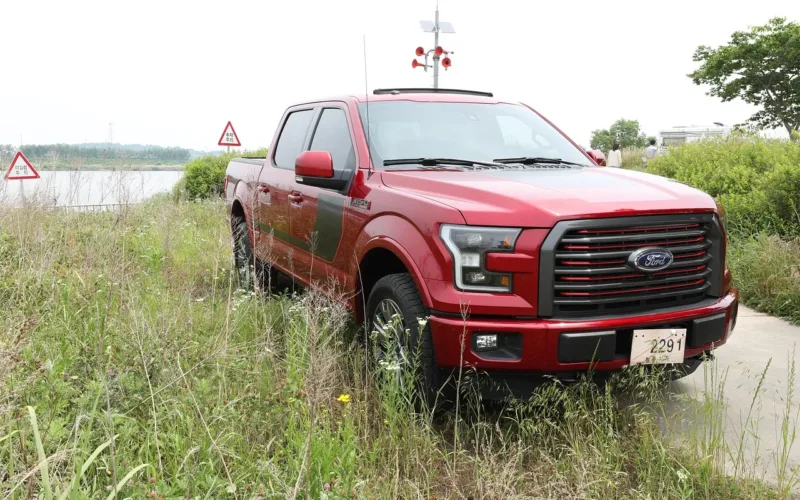 Red Ford F-150 crew cab pickup truck, the truck covered in this guide to the best speakers for ford f150