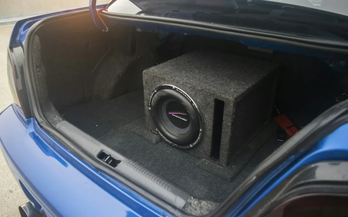 Subwoofer enclosure installed in a car trunk