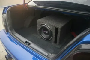 Subwoofer enclosure installed in a car trunk