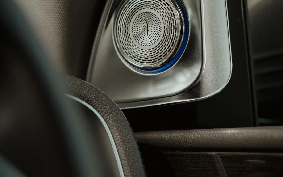 How to upgrade car speakers: metal speaker grille in a car door panel