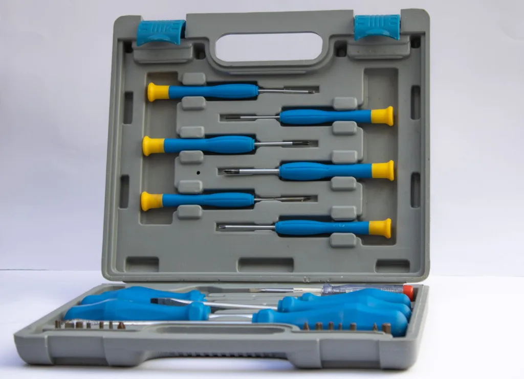 Screwdriver set and bits in an open plastic tool case