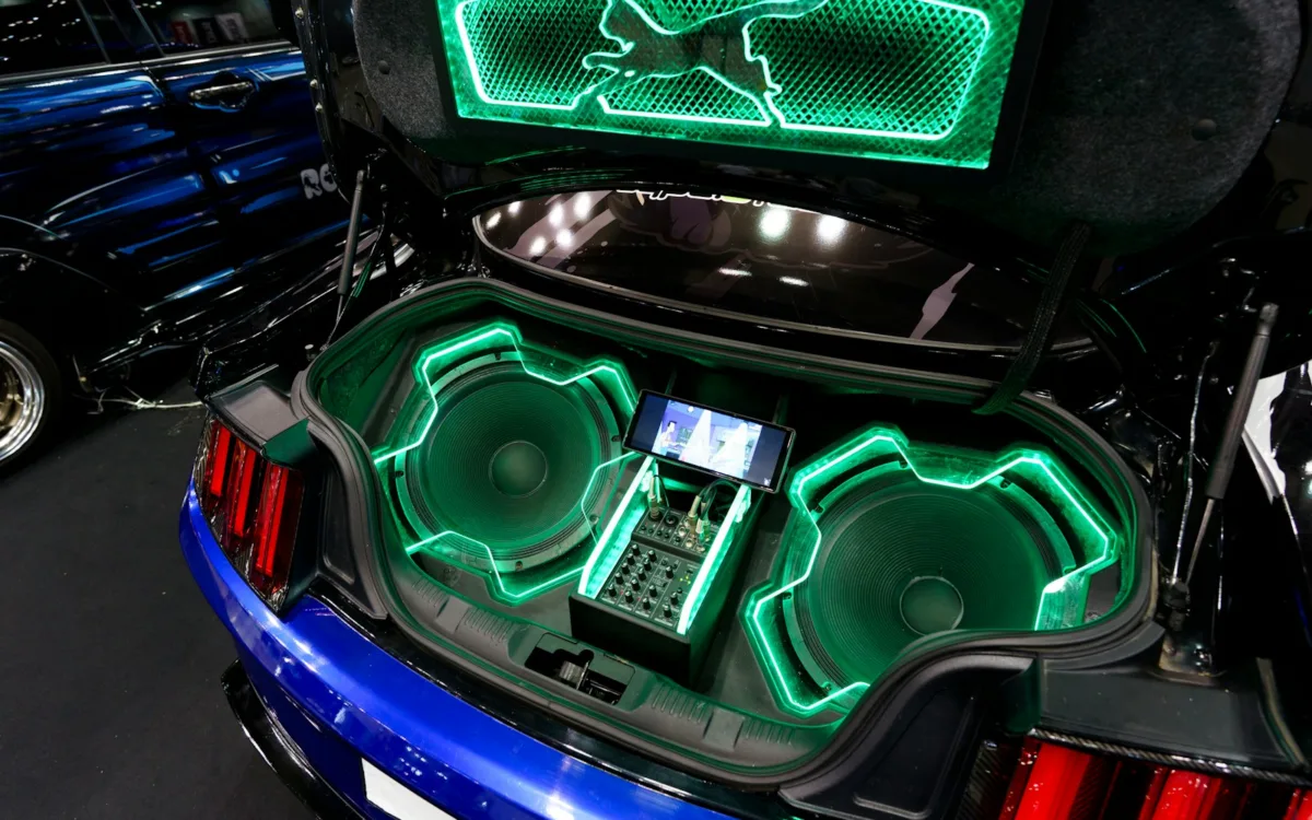 How to tune car subwoofer: two subwoofers in a custom car trunk with green lighting