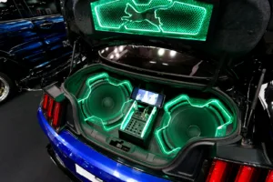 How to tune car subwoofer: two subwoofers in a custom car trunk with green lighting