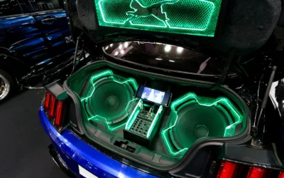 How to tune car subwoofer: two subwoofers in a custom car trunk with green lighting